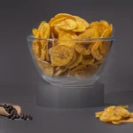 Jaambu Kerala Nendran Banana Chips, Pepper in a glass bowl