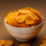 Jaambu Kerala Nendran Banana Chips, Hot & Spicy Chilly in a ceramic bowl