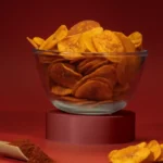 Jaambu Kerala Nendran Banana Chips, Hot & Spicy Chilly in a glass bowl