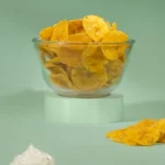 Jaambu Kerala Nendran Banana Chips, Sour Cream in a glass bowl