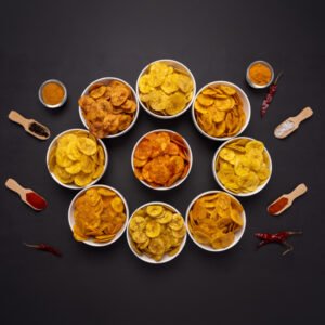 An assortment of Jaambu banana chips in ceramic bowls.